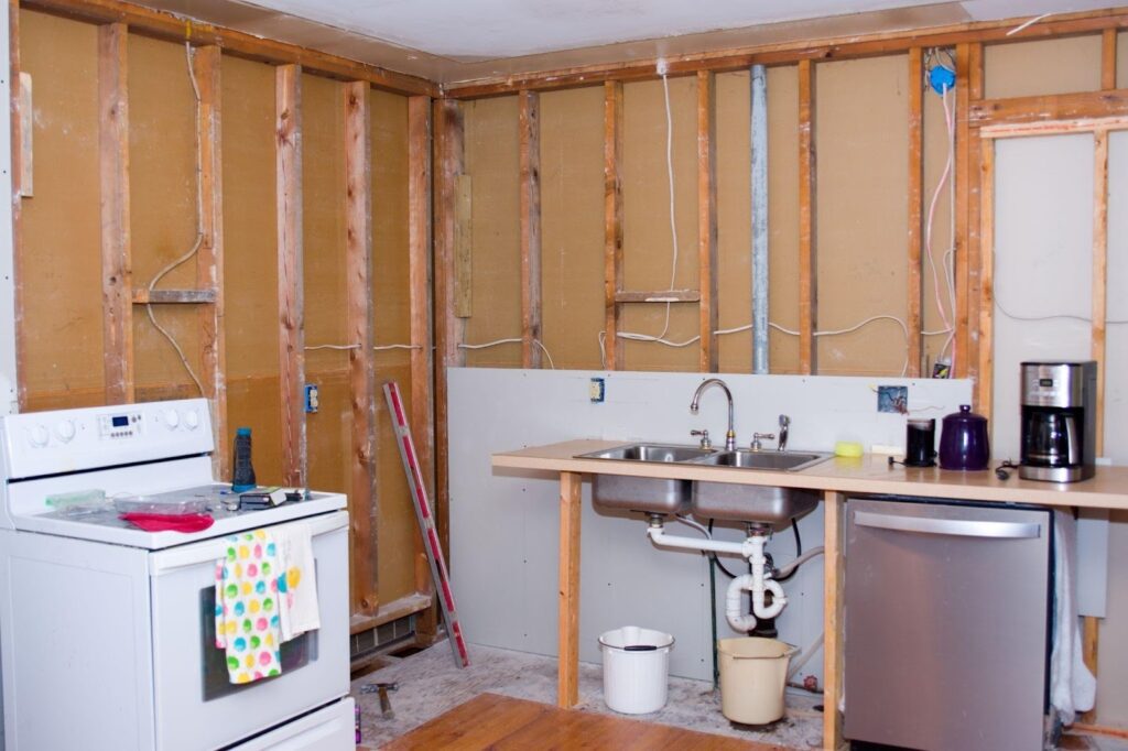 A kitchen featuring a sink stove and refrigerator showcasing a functional cooking space