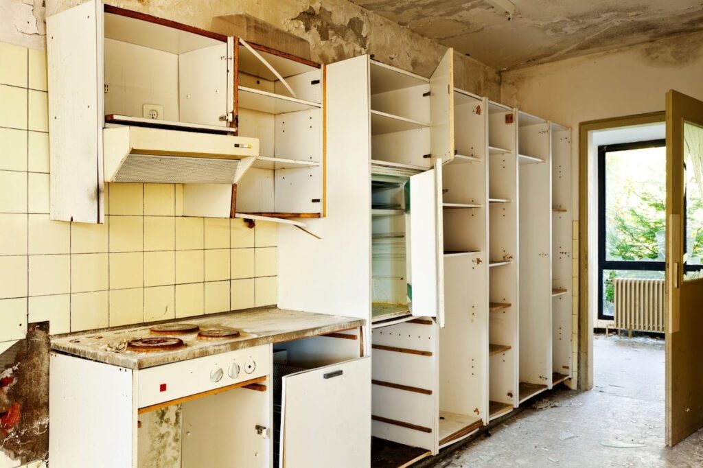 A modern kitchen featuring wooden cabinets and a stainless steel stove arranged for cooking and meal preparation